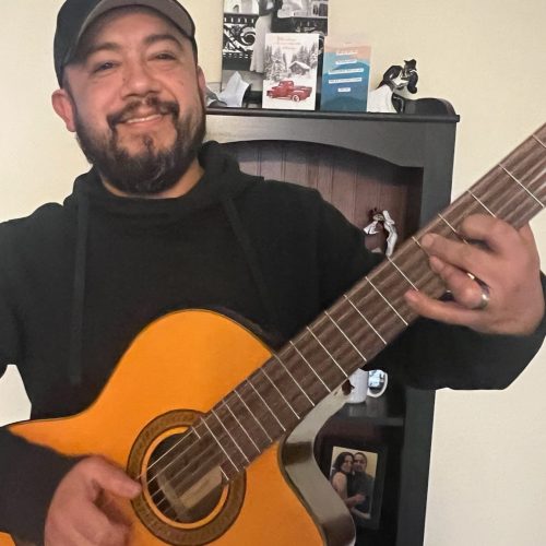 Playing Guitar has become a hobby and outlet for his creativity. He believes in serving the commnunity